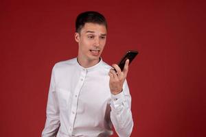 Image young business emotional excited screaming man in white shirt isolated photo