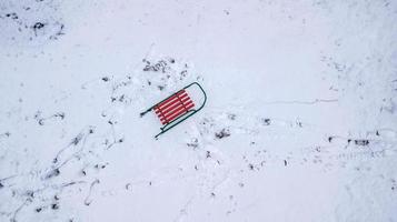 sled in the snow view from the quadcopter photo