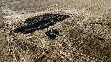 tractor in the field of aerial photography photo