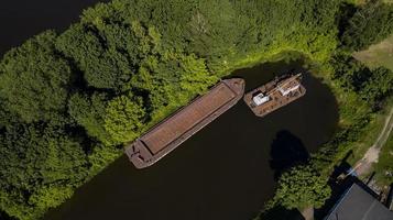 Barge on the river in the Amazon jungle top view from drone photo