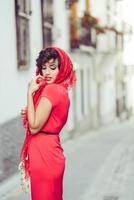 Beautiful woman in urban background. Vintage style photo