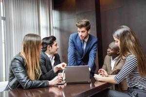 Group of multiethnic busy people working in an office photo