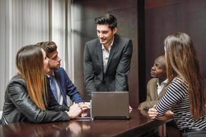 Group of multiethnic busy people working in an office photo