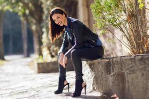 Young woman wearing casual clothes in urban background photo