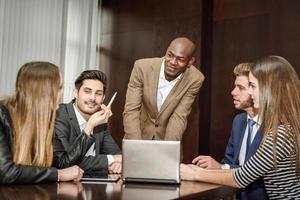 Group of multiethnic busy people working in an office photo