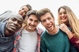 Multiracial group of friends taking selfie photo