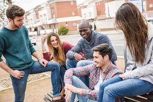 Group of friends having fun together outdoors photo