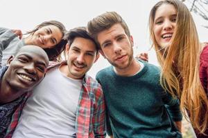 Multiracial group of friends taking selfie photo