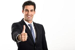 Businessman with thumb up on white background photo