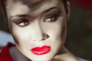 Young beautiful japanese woman with red dress photo