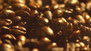 Macro shot of cup with hot coffee on roasted coffee beans in 4K video
