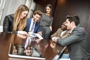 Group of multiethnic busy people working in an office photo