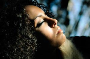 Black beautiful woman with closed eyes photo