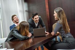 Group of multiethnic busy people working in an office photo