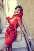 Beautiful woman in urban background. Vintage style photo