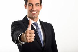Businessman with thumb up on white background photo