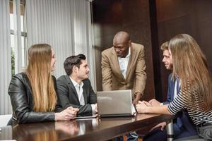 Group of multiethnic busy people working in an office photo