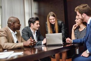 Group of multiethnic busy people working in an office photo