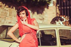 Beautiful woman in urban background. Vintage style photo