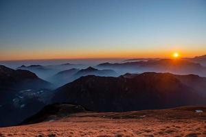 Mountains shrouded in fog photo