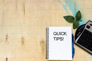 Cup of coffe and open notebook on wooden background photo