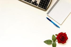 Cup of coffe and open notebook on white background photo