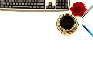 Cup of coffe and open notebook on white background photo