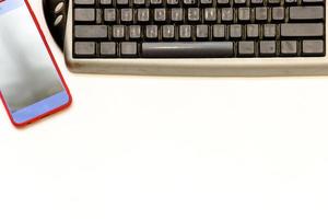 Cup of coffe and open notebook on white background photo