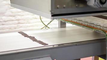 Factory for the production of sweets and chocolate. Automatic line for the production of chocolate in an industrial factory. Conveyor belt with sweets. Sweets production process. Food industry. photo