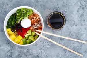 Poke with vegetables and fresh salmon. Studio Photo