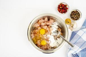 Pieces of chicken fillet, raw eggs, spices for cooking. Studio Photo