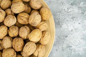 tasty Unpeeled walnuts, background, texture. Studio Photo