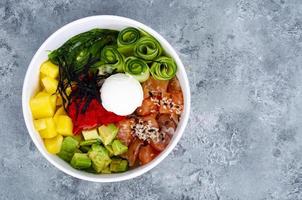 Poke with vegetables and fresh salmon. Studio Photo