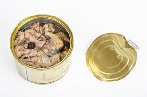 Open metal can with canned fish in its own juice. Studio Photo