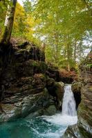 River waterfall in spring photo