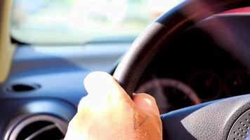 Tattooed hand on handlebar steering wheel while driving in Mexico. video