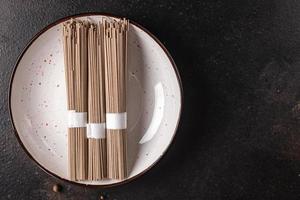 soba noodles buckwheat raw udon noodle ready to cook photo