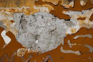 Cracked and abstract grunge texture. Aged material surface backdrop. Weathered effect pattern. Old and dirty background. photo