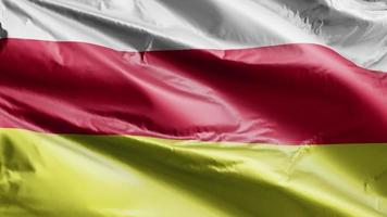 South Ossetia flag slow waving on the wind loop. South Ossetia banner smoothly swaying on the breeze. Full filling background. 20 seconds loop. video