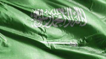 Saudiarabiens textilflagga vajar på vindslingan. saudiarabien banner vajande på vinden. tyg textilvävnad. full fyllning bakgrund. 10 sekunders loop. video