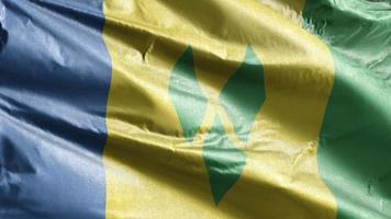 Saint Vincent and the Grenadines textile flag slow waving on the wind loop.  Fabric textile tissue. Full filling background. 20 seconds loop. video