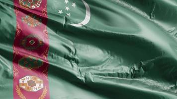 Turkmenistan flag waving on the wind loop. Turkmenistani banner swaying on the breeze. Full filling background. 10 seconds loop. video