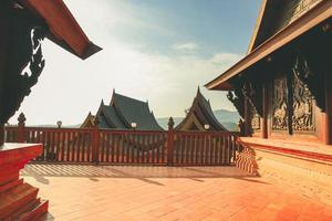 Loei, Thailand 12,2021 Wat Somdet Phu Ruea Ming Mueang Temple. The temple is built with fine wood timber. The church is made of teak and locate on mountain and one of top viewpoint at Phu ruea. photo