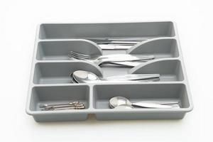 Kitchen box with cutlery for spoons, forks, knifes on white background photo