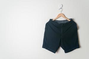 short pants hanging on wall photo