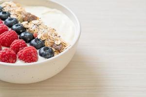 homemade yogurt bowl with raspberry, blueberry and granola photo