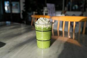 matcha green tea latte blend in glass photo