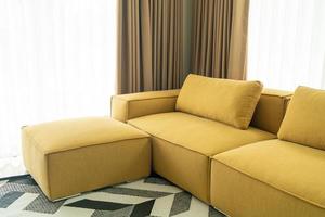 empty yellow fabric sofa in living room photo