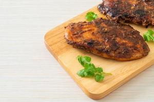 spicy grilled jamaican jerk chicken photo