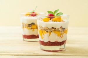 homemade mango and raspberry with yogurt and granola photo